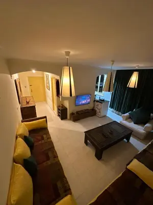 a living room with a couch and a coffee table at مراكش كليز in Marrakech