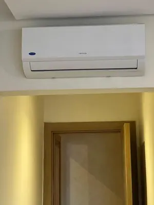 a television on top of a ceiling in a room at Apartment with swimming pool full air-conditioned in Marrakech