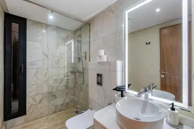 a bathroom with a sink and a shower at Sublime Villa in Agdal Elevator with heated pool in Marrakech
