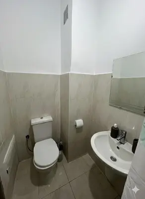 a bathroom with a toilet and a sink at RS 13 by KMREI Properties in Marrakech