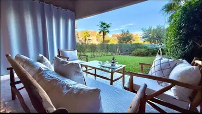a patio with couches and a table with a view at Fabuleux T4 110 m2 prestigia Luxury in Marrakech
