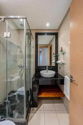 a bathroom with a sink and a shower at Cozy Apt with pool, Wifi, parking, Golf Views & Sunny Private Balcony in Marrakech