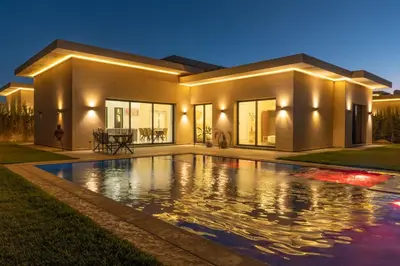 a house with a swimming pool in front of it at Domaine des lumières in Segraga