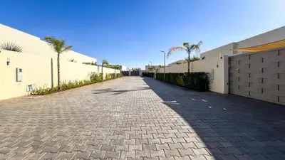 a cobblestone street in front of a building at Beautiful Stella villa with heated pool, Marrakech in Marrakech