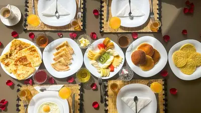 a table full of plates of food on a table at Villa Eden in Marrakech