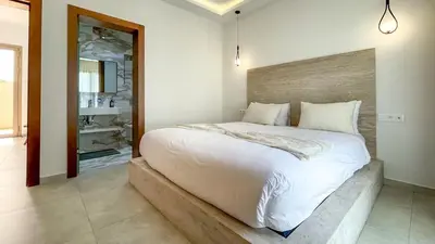 a bedroom with a large white bed in a room at Villa Eden in Marrakech