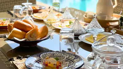a table with plates of food on a table at Villa DALIA in Marrakech