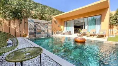 a swimming pool in a house with a house at Villa Balzac Marrakech with heated pool in Marrakech