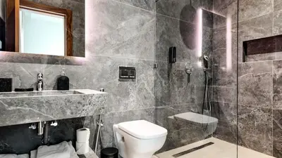 a bathroom with a toilet and a sink and a shower at Villa Clea heated pool not overlooked in Marrakech
