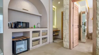 a kitchen with a sink and a counter with a microwave at Targa Bungalow - Heated pool, not overlooked in Marrakech