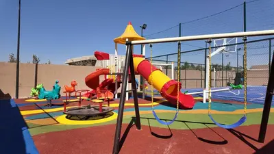 a childrens playground with a slide and a slidesktop at Agdal Bungalow - Heated swimming pool, not overlooked in Marrakech