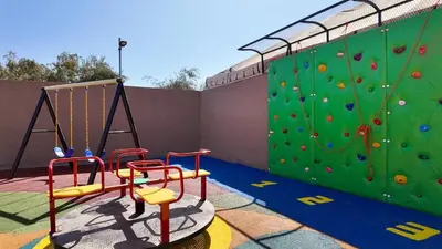 a gym with a rock wall and a climbing wall at Palm Grove Bungalow - Heated pool, not overlooked in Marrakech
