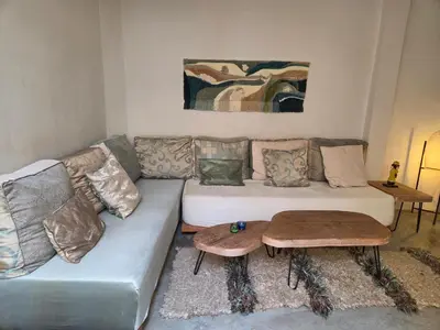 a living room with a couch and a table at Riad Yara Farah in Marrakech