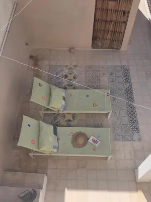 an overhead view of a table with pillows on it at Riad Yara Farah in Marrakech