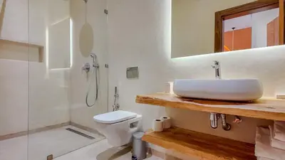 a bathroom with a sink and a toilet and a shower at Villa Maréa heated pool not overlooked in Marrakech