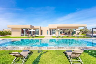 a villa with a swimming pool and a house at Prestige Villa Heated Pool Total Quiet in Marrakech