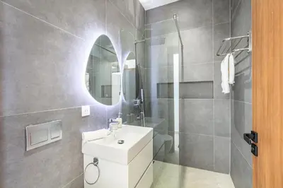 a bathroom with a white sink and a mirror at Dream Getaway Intimate Villa Private Pool in Marrakech