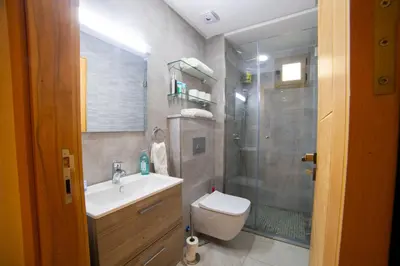 a bathroom with a toilet and a sink and a shower at Stylish &cosy 1-Bedroom in Marrakech