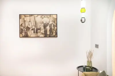 a living room with a painting on the wall at Apartment in Victor Hugo 10 minutes from Jemaa el-Fna in Marrakech