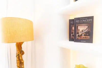 a lamp sitting next to a shelf with a book at Apartment in Victor Hugo 10 minutes from Jemaa el-Fna in Marrakech