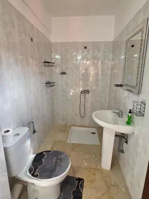 a bathroom with a toilet and a sink at apartt le Palmier de Guéliz in Marrakech