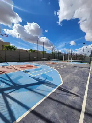 an empty basketball court with a basketball hoop at Modern design and jacuzzi in Marrakech