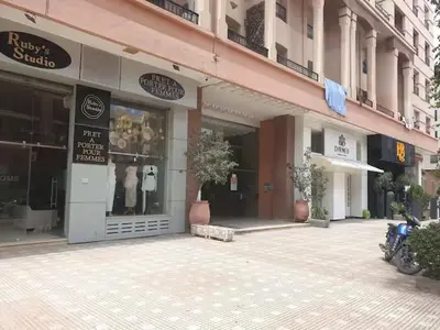 an empty street with a store in a building at Central location in Gueliz in Marrakech