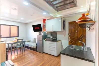 a kitchen with a sink and a counter top at Heart of Gueliz - Nice 2BR Flat near Train Station in Marrakech