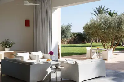 a living room with white couches and tables at Elegant 3-BR Villa with breakfast included in Marrakech