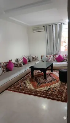 a living room with a couch with a coffee table at Au Cœur de L'hivernage P09 in Marrakech