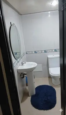 a bathroom with a sink and a toilet and a mirror at Au Cœur de L'hivernage P09 in Marrakech