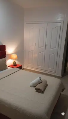 a bedroom with a bed with towels on it at Au Cœur de L'hivernage P09 in Marrakech