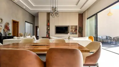 a dining room with a wooden table and chairs at Villa Janna heated pool without overlooking in Marrakech