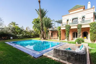 an estate with a swimming pool in front of a house at Villa Soleil Private Pool & Garden in Marrakech