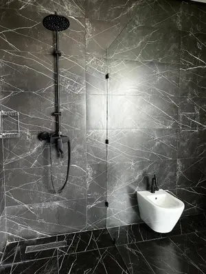 a bathroom with a shower and a sink at Exceptional Villa Noria Golf in Marrakech