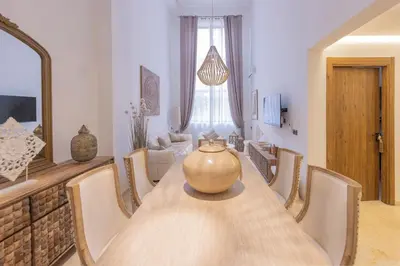 a large vase sitting on a wooden table in a room at Sublime 3-bedroom duplex with pool in Marrakech