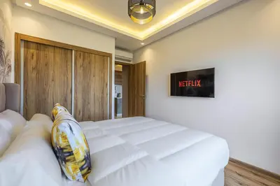 a bedroom with a large white bed in a room at Noria Modern & Cozy Piscine in Marrakech