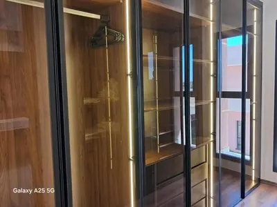 a glass cabinet in a room with a window at Exceptional Villa Private Pool and Breakfast in Marrakech