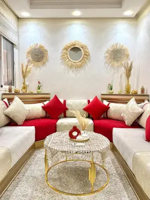 a living room with red and white couches at Appartement Artiste in Marrakech