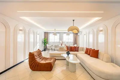 a living room with a couch and a table at Luxury Apartment In Majorelle Downtown Speed Wi-Fi and AC Calm in Marrakech