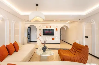 a living room with a couch and chairs at Luxury Apartment In Majorelle Downtown Speed Wi-Fi and AC Calm in Marrakech
