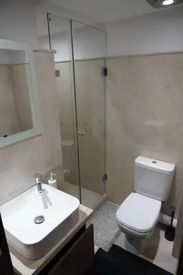 a bathroom with a toilet and a sink and a shower at Mamounia loft by M&I in Marrakech