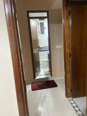 a small bathroom with a mirror and a sink at Apartment in Marrakech Mabrouka in Marrakech