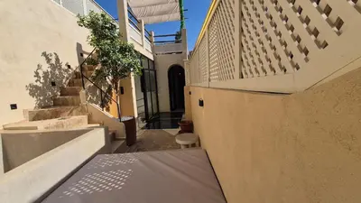 a hallway of a house with stairs and a balcony at Riad Casa Léa - Palais Bahia - Bassin & Pt Déj in Marrakech