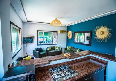 a kitchen with a stove top in a living room at Appart du centre 9 in Marrakech