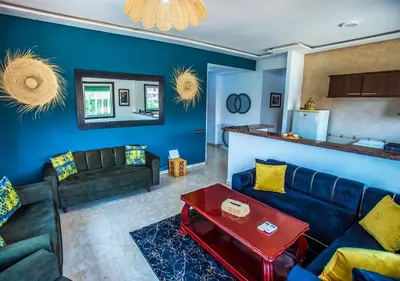 a living room with a couch and a table at Appart du centre 9 in Marrakech