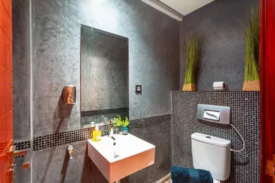 a bathroom with a sink and a toilet at Menara gardens in Marrakech