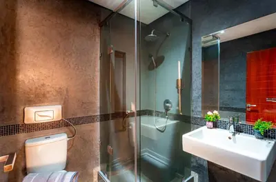 a bathroom with a toilet and a sink and a shower at Menara gardens in Marrakech