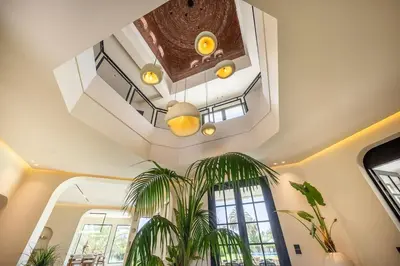 a room with a ceiling with a staircase and a plant at MIKESTAY Domaine ATIKA in Segraga