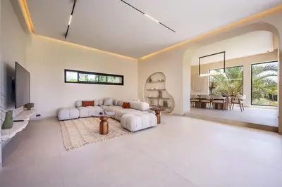a large living room with a couch and a table at MIKESTAY Domaine ATIKA in Segraga